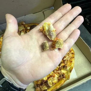 Over cooked chicken that covered our pizza