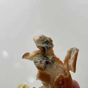 MOLD. Molded bagel covered up with cream cheese