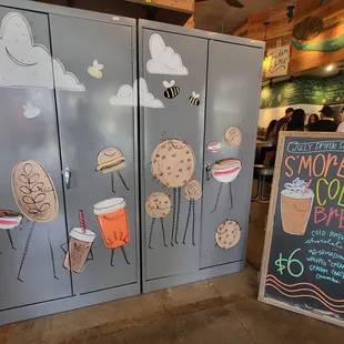 a chalkboard with a drawing of food and drinks
