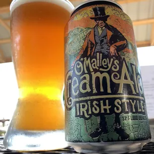 a can and a glass of beer