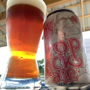 a can and a glass of beer