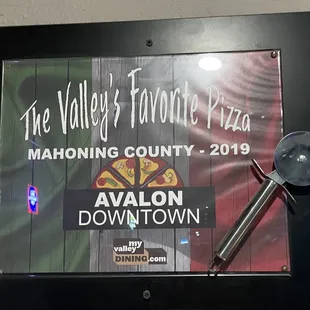 a sign for the valley&apos;s favorite pizza