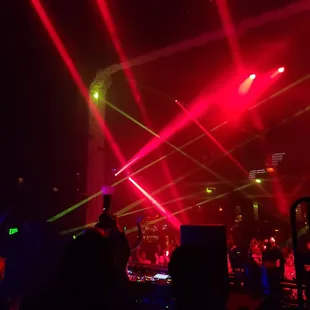 red and green lasers in the sky