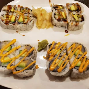 Spicy scallop avocado roll (front), eel avocado cucumber roll (back)
