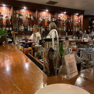 a woman behind the bar