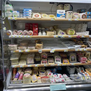 a display of cheeses and cheeses