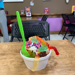 Cannoli with sprinkles, gummy bears, and gummy worms.