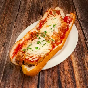 Eggplant Parmigiana Hot Sub: Served with provolone cheese and marinara sauce