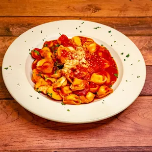 Cheese Tortellini: Cooked to order and sautéed in our house sauce with or without garlic, tossed with grated cheese