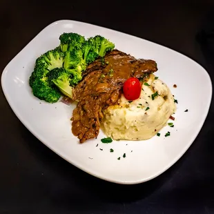 Brazilian Sirloin Steak B.B.Q.: Topped with demi glazed sauce served with mashed potato and broccoli