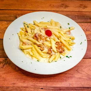 Pasta Carbonara: Sautéed in our cream sauce with egg, bacon and grated cheese