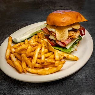 XXX TUDO BURGER: 8 oz burger, with bacon, ham, grilled chicken, fried egg, cheese, lettuce, tomato, onion, &amp; mayo