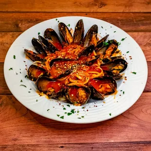 Musseles Fra Diavolo: Sauteed mussels, garlic &amp; oil, tossed in our house sauce with hot crushed pepper, tossed with choice of pasta