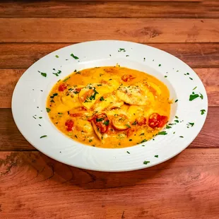 Lobster Ravioli: Sauteed in our house sauce with or without garlic tossed with grated cheese