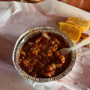 a bowl of chili and cheese