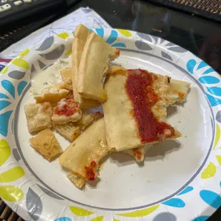 a plate of pizza and subs