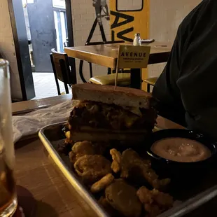 Special slow roasted brisket sandwich with fried pickles. Sorry, about pic. need more lighting in high top bar area