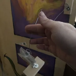 Wire came right off and art fell to the floor.