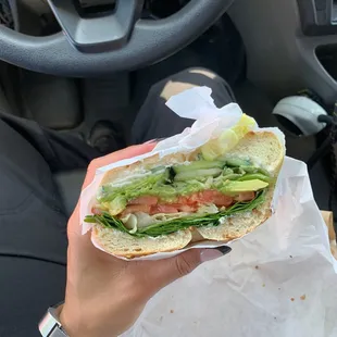Veggie sandwich on a garlic and salt bagel