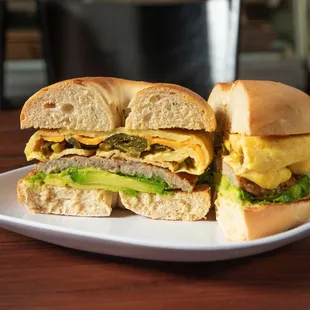 Avocado sausage breakfast bagel sandwich with pickled jalapeños ‍