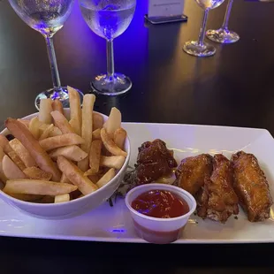 Bourbon chicken wings and fries