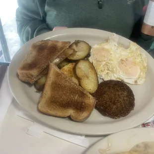 a plate of breakfast food and a cup of coffee