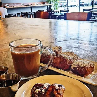 Beignet with chocolate sauce and berry coulis