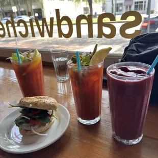 Berry smoothie, vegan bagel sandwich and two bloody Mary's