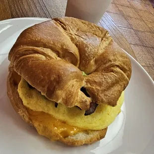 Breakfast croissant with added bacon and avocado.