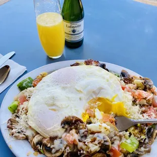 Veggie potato platter with eggs over easy. Delicious!