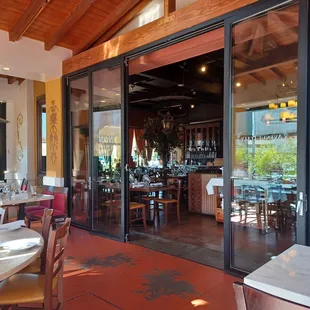 a view of a dining area with tables and chairs