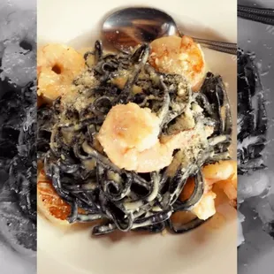 a plate of pasta with shrimp