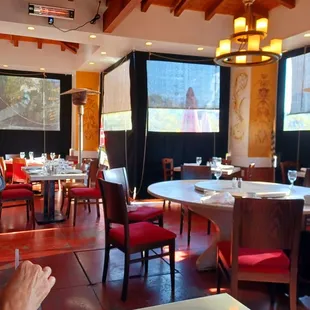 a dining room with tables and chairs