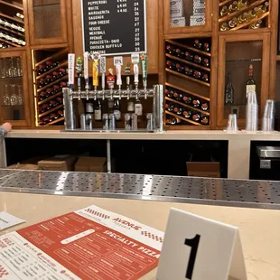 a bar with a menu on the counter