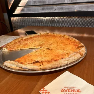 a pizza with a slice taken out of it