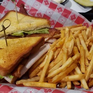 Club sandwich and fries