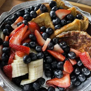 French Toast with strawberries bananas blueberries and sausage.  Always so good.