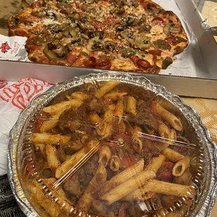 a pizza and a pasta dish