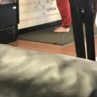 a person standing in a coffee shop