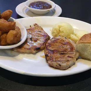 Pork Chops w/ mashed potatoes and corn nuggets. The pork chops were d Very dry! Will not return to this establishment