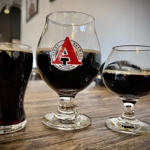 three glasses of beer on a table