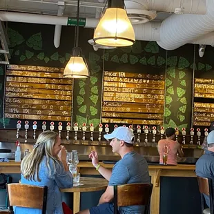 Bar area  with multiple of their own beers on tap