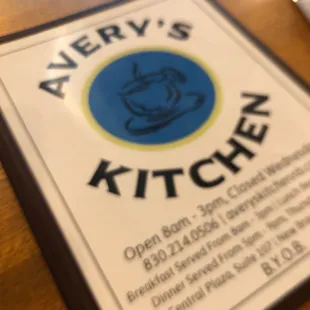 a menu on a wooden table