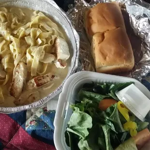 Fettuccine, salad,and rolls