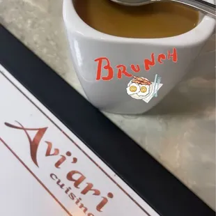 a cup of coffee with a spoon