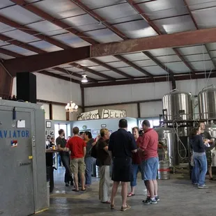 a large group of people standing in a building