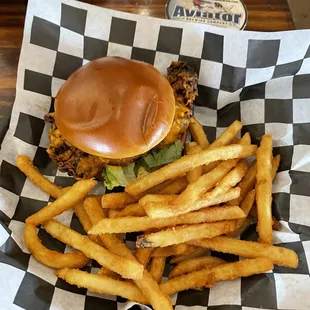 Fried chicken sandwich dipped in wing sauce