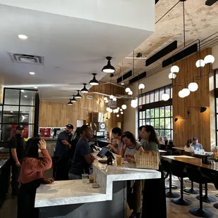 a group of people sitting at the counter
