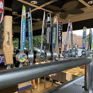 a row of beer taps