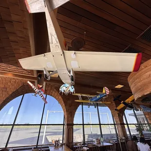 a model airplane suspended from the ceiling
